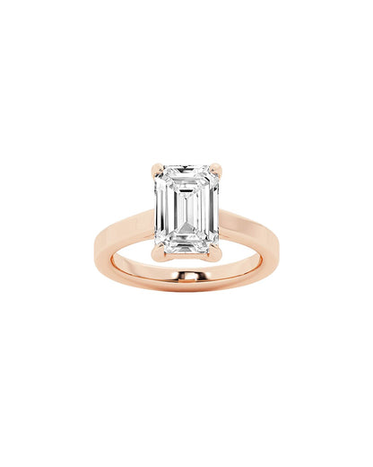 Rose gold ring with a large diamond on a white background