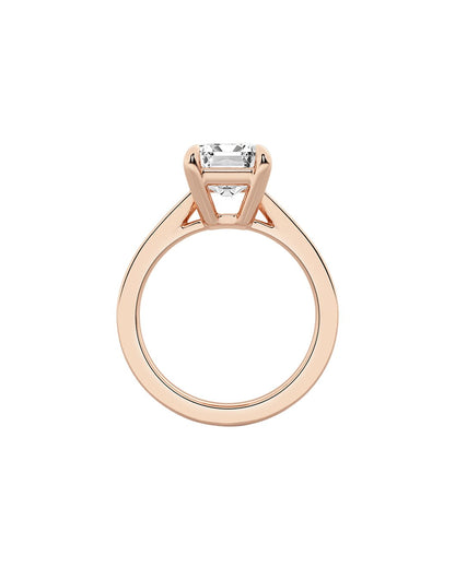 Rose gold ring with a diamond on a white background