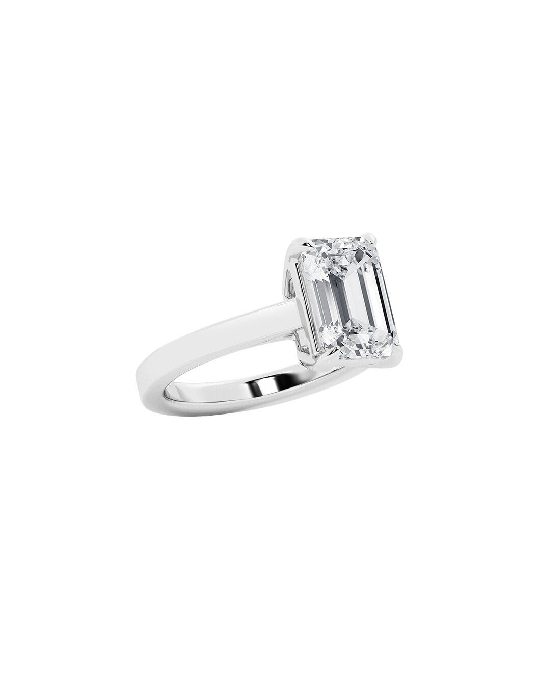Diamond ring with an emerald cut diamond stone on a white background