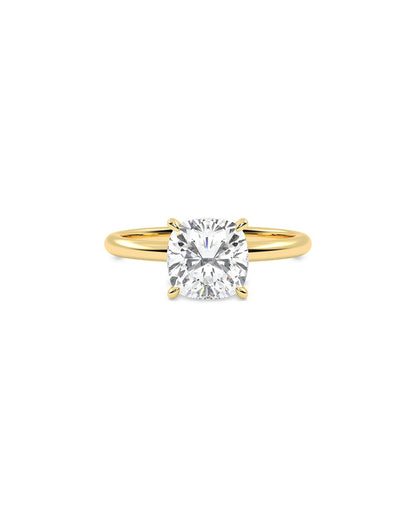 Gold ring with a diamond on a white background