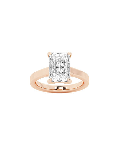 Rose gold ring with a large diamond on a white background