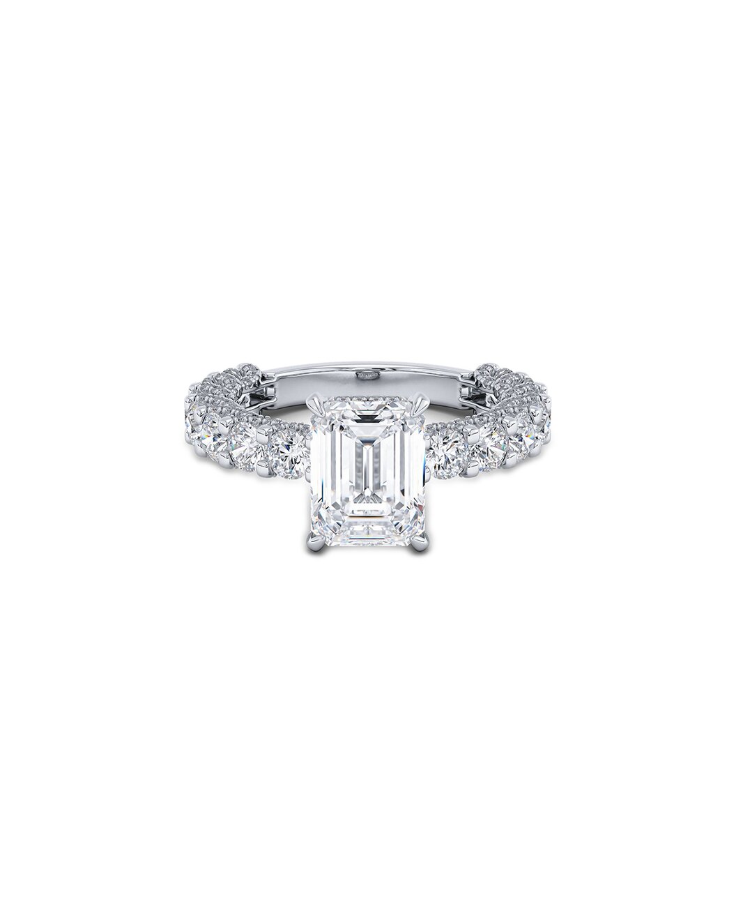 Diamond ring with emerald-cut center stone on a white background