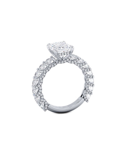 Diamond ring with a central stone and smaller stones on a white background