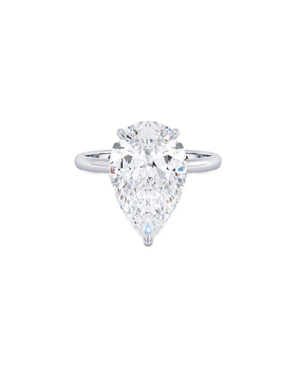Pear-shaped diamond ring on a white background