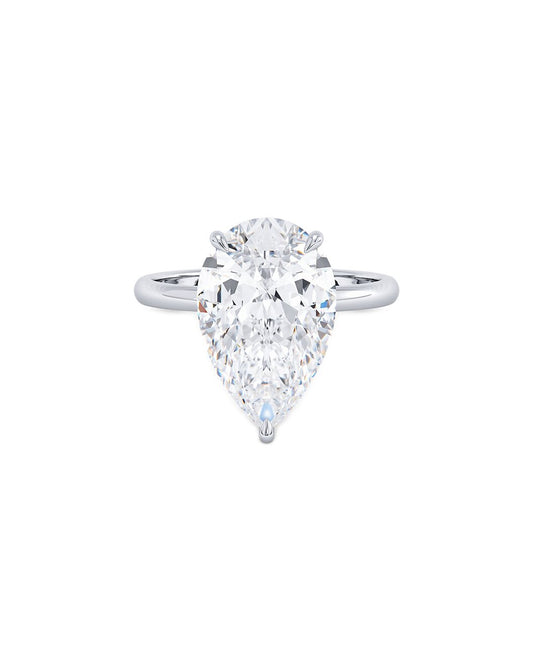 Pear-shaped diamond ring on a white background