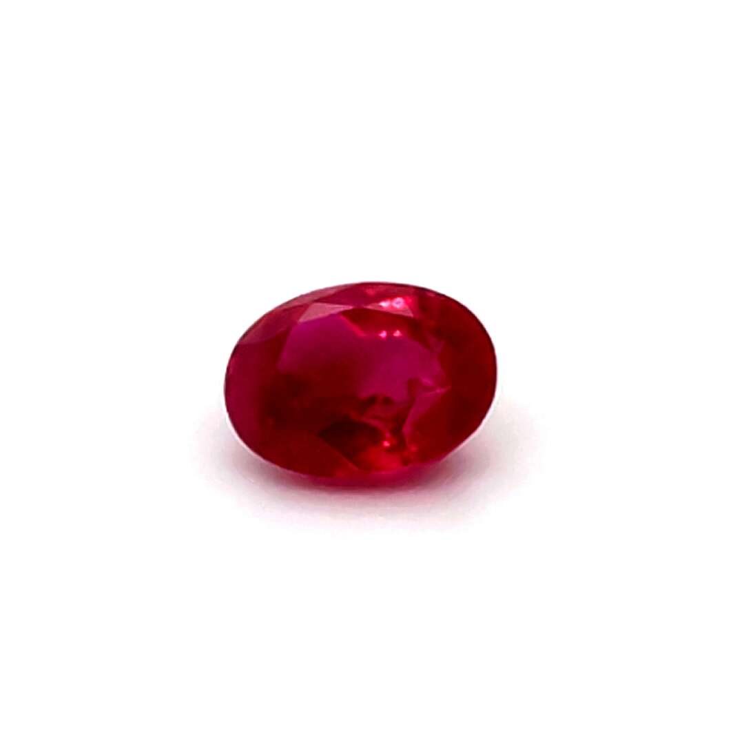 Red gemstone on a white background
