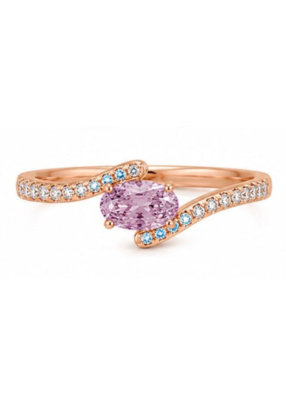 Perspective view of a custom bypass engagement ring featuring a 0.60 carat Fancy Intense Pink Purple oval diamond with micro pavé white diamonds.