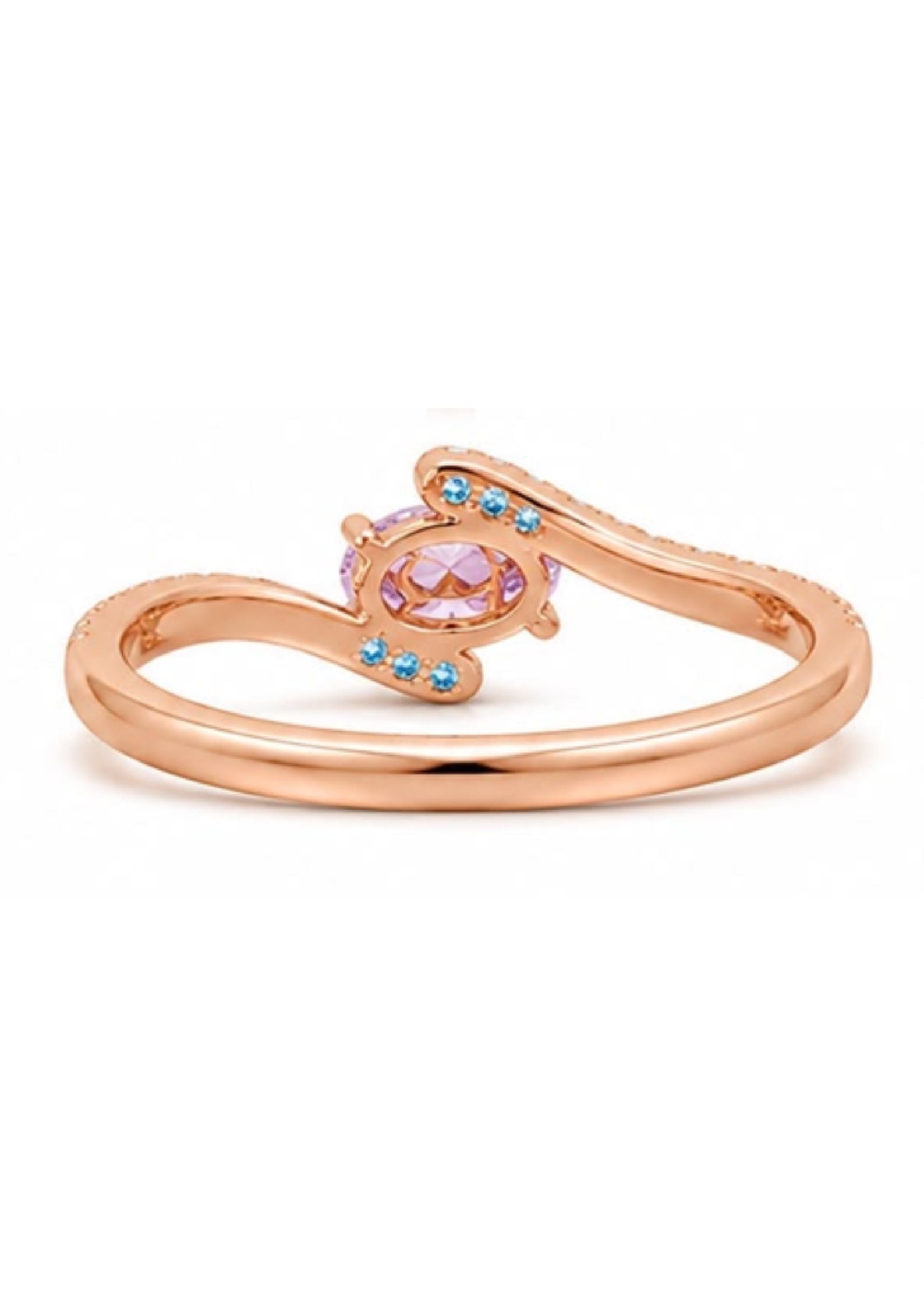 Underside detail of a custom Fancy Intense Pink Purple oval diamond bypass engagement ring showcasing blue diamond accents and an elegant open gallery.