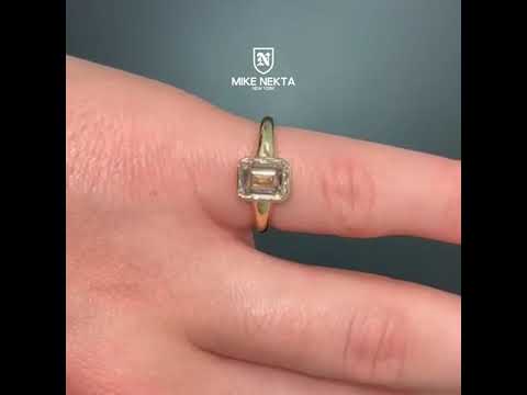 Liora-Jade 1.37 Carat Emerald Cut Lab Grown Diamond Solitaire Bezel Engagement Ring in 14k Yellow Gold Video