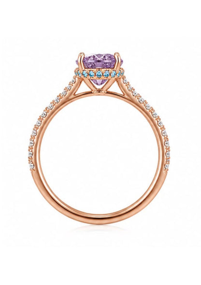 Side profile showing aqua blue diamond hidden halo beneath a Fancy Intense Pink Purple oval diamond.