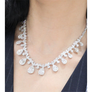 White gold diamond necklace containing round and baguette diamonds Pear Shape teardrop style