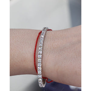 8 1/2 carat Lab Grown Diamond tennis bracelet white gold Four prong round diamond Pictured on a woman's wrist accessorize with the red string