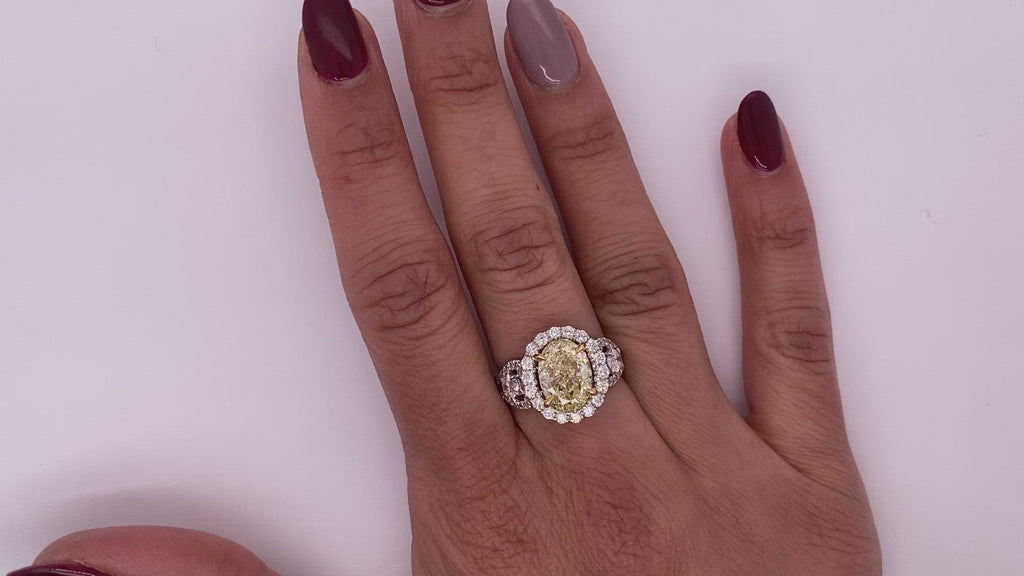 Light Yellow Diamond Ring Oval Cut Halo Ring in 18K White Gold Video on Hand