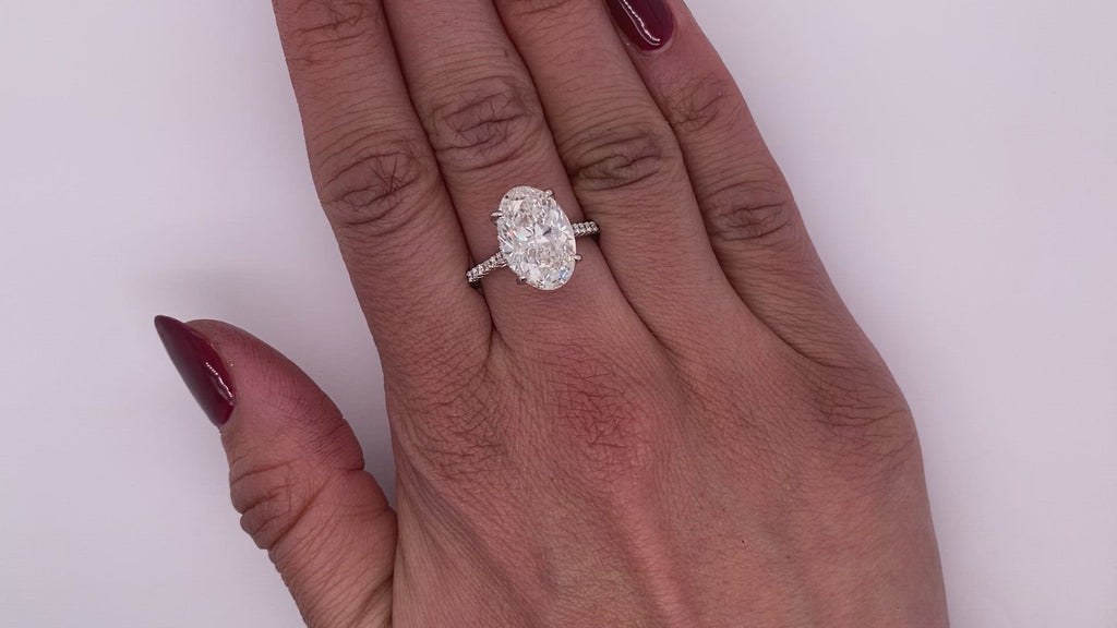 Diamond Ring Oval Cut 6 Carat Sidestone Ring in 18K White Gold Video on Hand