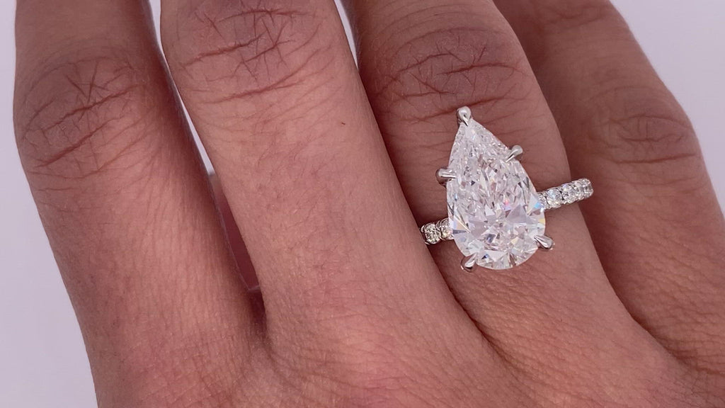Tiffany Novo® Oval Brilliant Engagement Ring with a Pavé Diamond Platinum  Band
