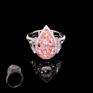 Pink diamond Pear Shape ring on a black background