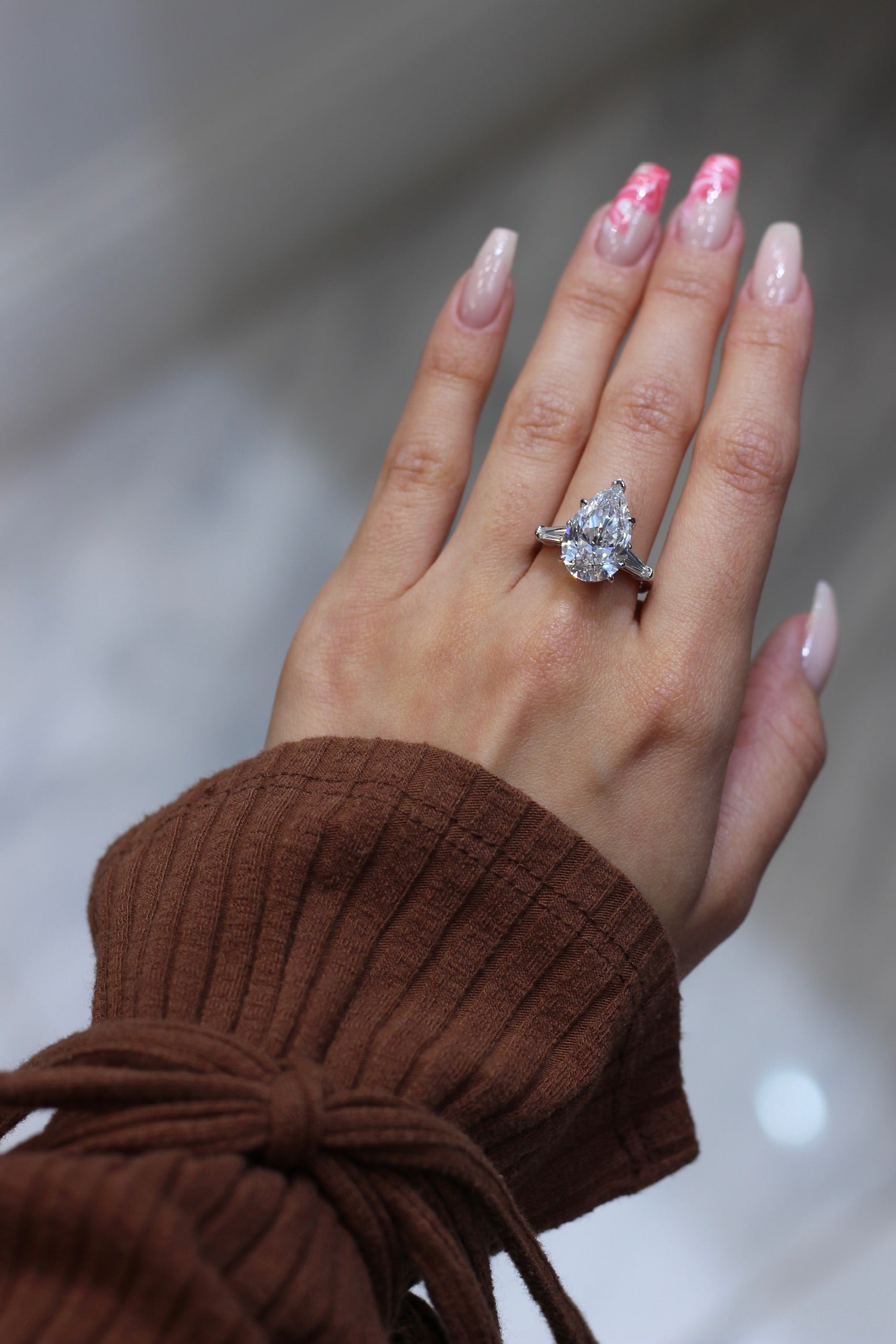 7 carat pear shape cut diamond engagement ring solitaire with tappered baguettes set in platinum