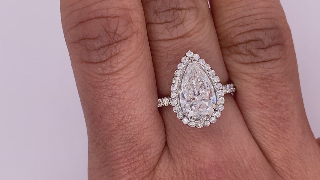 Diamond Ring Pear Shape Cut 3 Carat Halo Ring in Platinum Video on Hand