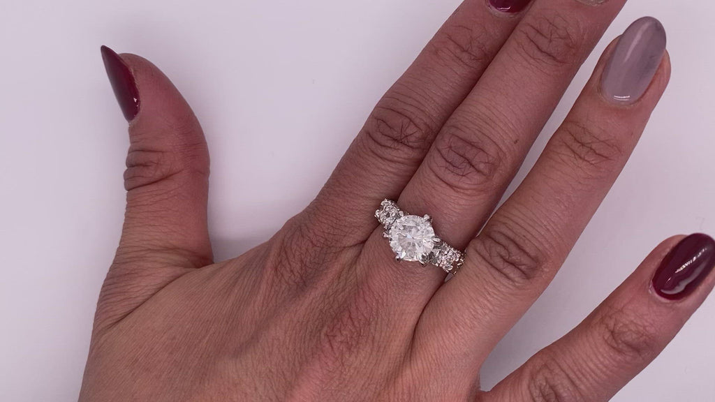 Diamond Ring Round Cut 7 Carat Sidestone Ring in 18K White Gold Video on Hand